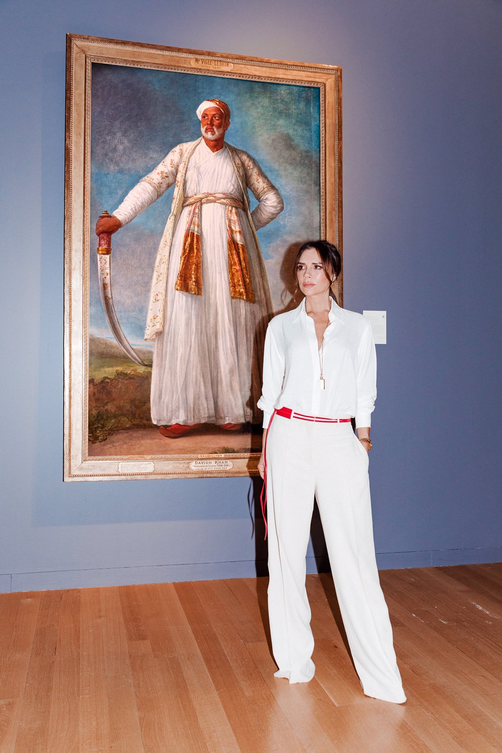 Victoria Beckham with Elisabeth-Louise Vigée Le Brun's Portrait of Muhammad Dervish Khan at the exhibition for "The Female Triumphant" at Sotheby's New York. Photo courtesy of Tom Newton.