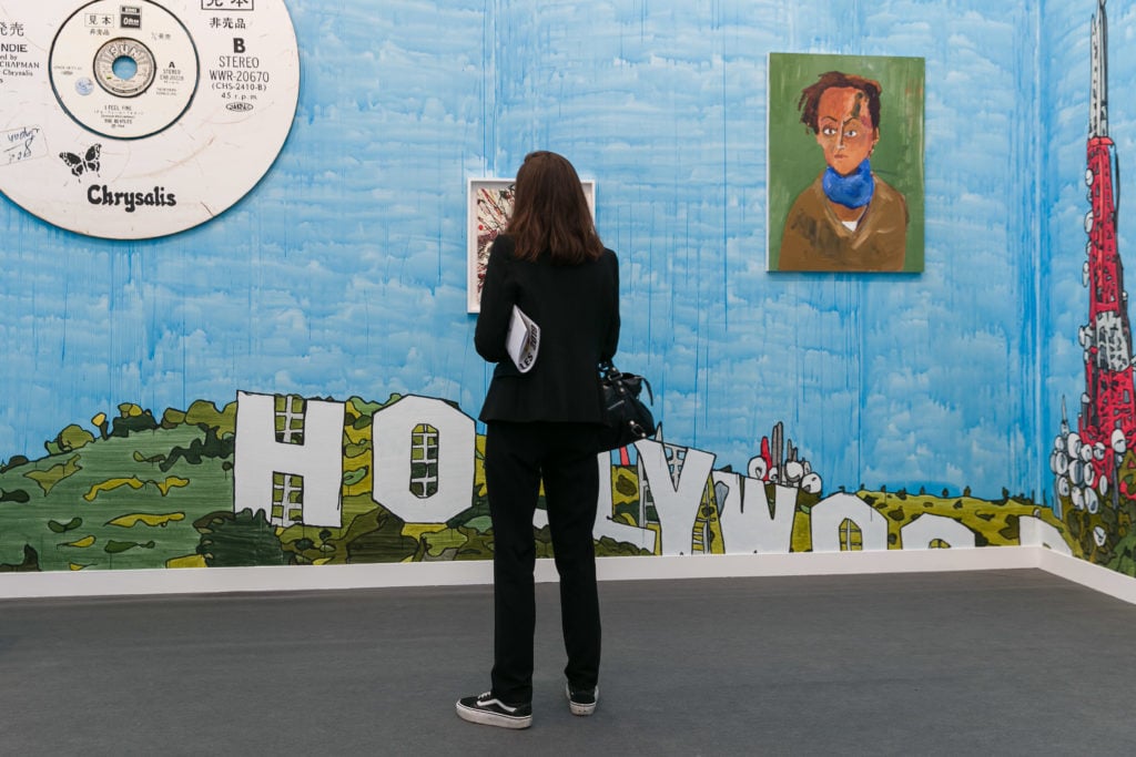 A visitor to Blum & Poe's booth at the inaugural Frieze Los Angeles in 2019. Photo by Mark Blower. Courtesy of Mark Blower/Frieze.