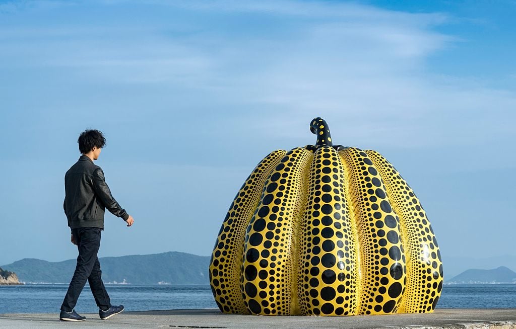 Yayoi Kusama's <i>Yellow Pumpkin</i> in Naoshima, Japan. Photo by Education Images/UIG via Getty Images.