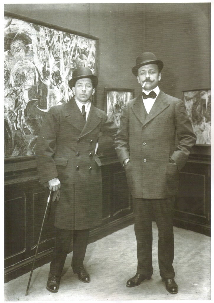 Italian Futurists Umberto Boccioni and Filippo Tommaso Marinetti at the first Futurist show in Paris, at the Galerie Bernheim-Jeune in 1912. Photo by Fine Art Images/Heritage Images/Getty Images.