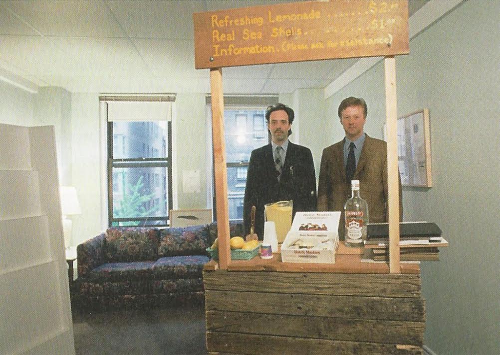 Colin de Land and Christian Nagel with Mark Dion's <em>Lemonade Stand</em> at the Gramercy International in 1994. Courtesy Galerie Nagel Draxler.