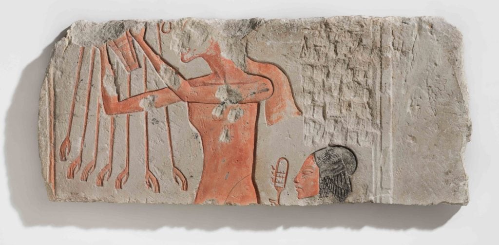 Akhenaten and His Daughter Offering to the Aten. New Kingdom, Dynasty 18, Amarna Period, reign of Akhenaten, circa 1353–1336 BC. Made for a temple in Hermopolis Magna, Egypt. Photo courtesy of the Brooklyn Museum, Charles Edwin Wilbour Fund.