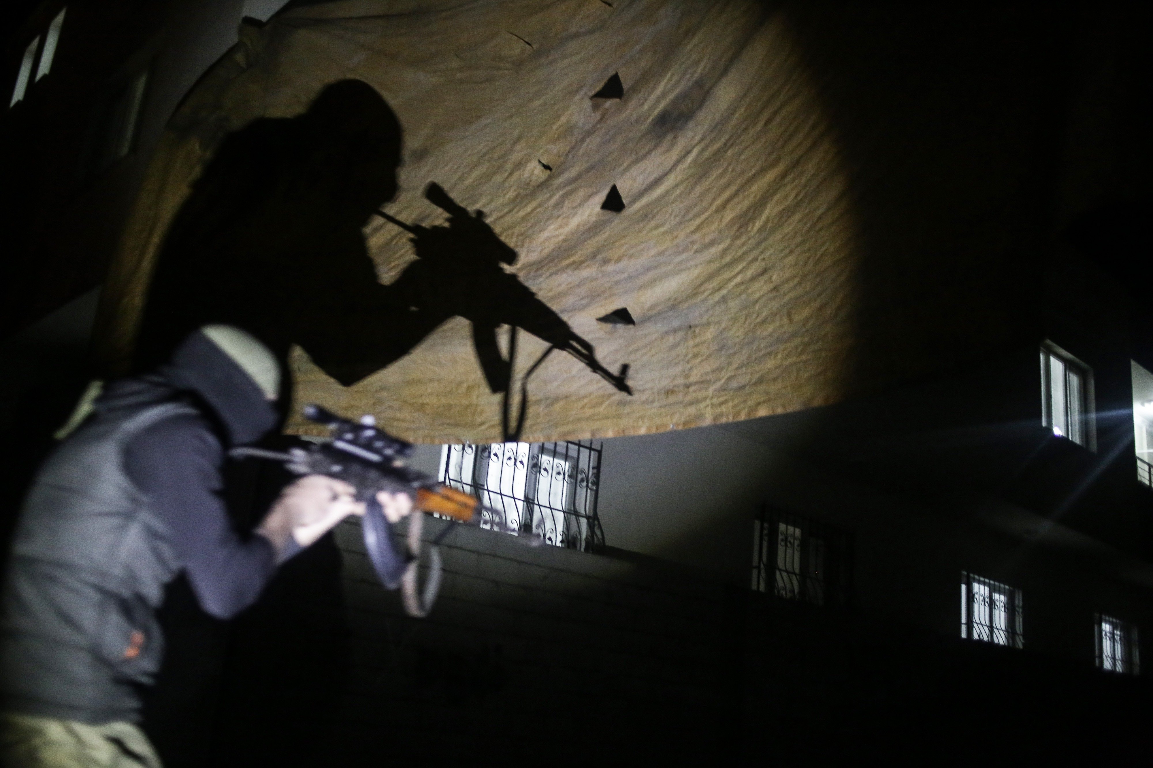 A member of armed group Patriotic Revolutionary Youth Movement (YDG-H), a youth division of the Kurdistan Workers' Party, PKK, moves for an attack to Turkish security forces in southeastern Turkish city of Nusaybin, February 29, 2016. Photo: Cagdas Erdogan/Getty Images.