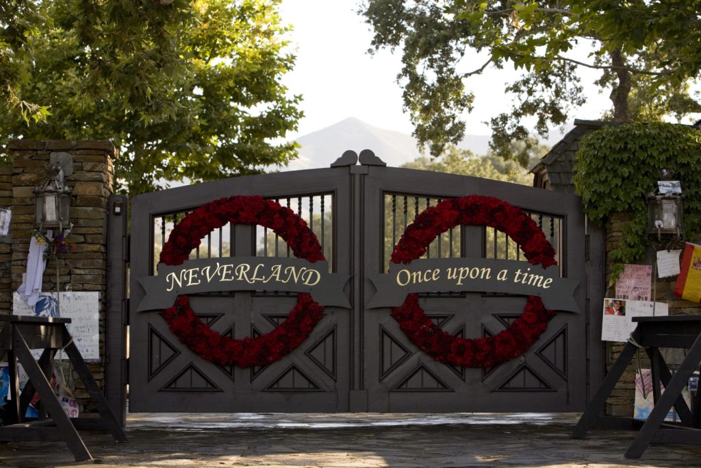 The gates to Michael Jackson's Neverland Ranch, among the places where he is alleged to have serially sexually abused children for years, after the singer's death in 2009. Photo by George Rose/Getty Images.