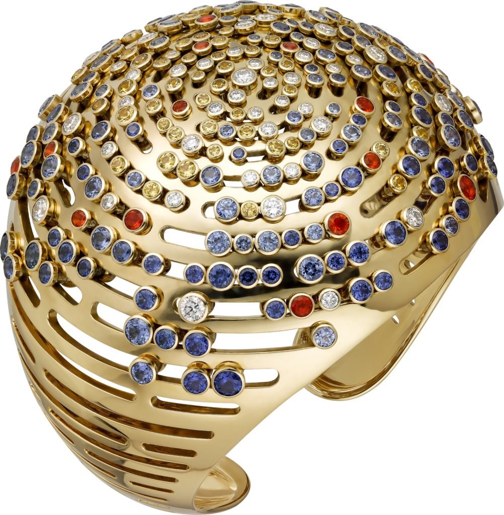 A Les Galaxies de Cartier "The Earth's Lights" bracelet with 18k yellow gold, diamonds, yellow sapphires, blue sapphires, and fire opals. From a limited edition of eight numbered pieces.