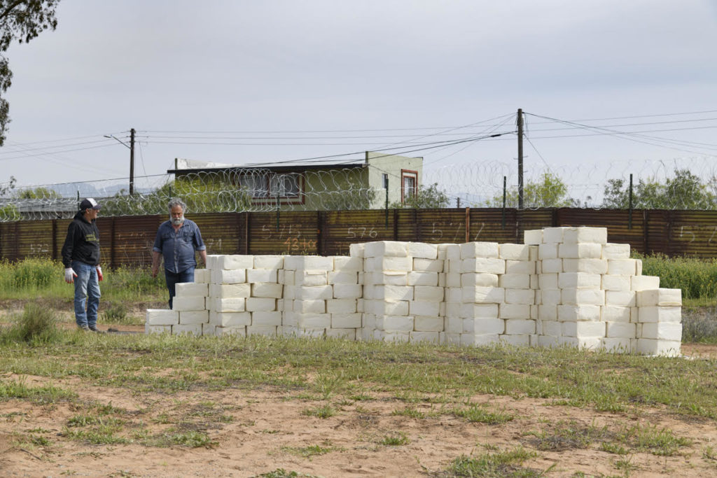 Cosimo Cavallaro is building a wall of cotija cheese along the US Mexico border. Photo by Alan Schaffer, courtesy of the artist and Sarah Cavallaro.