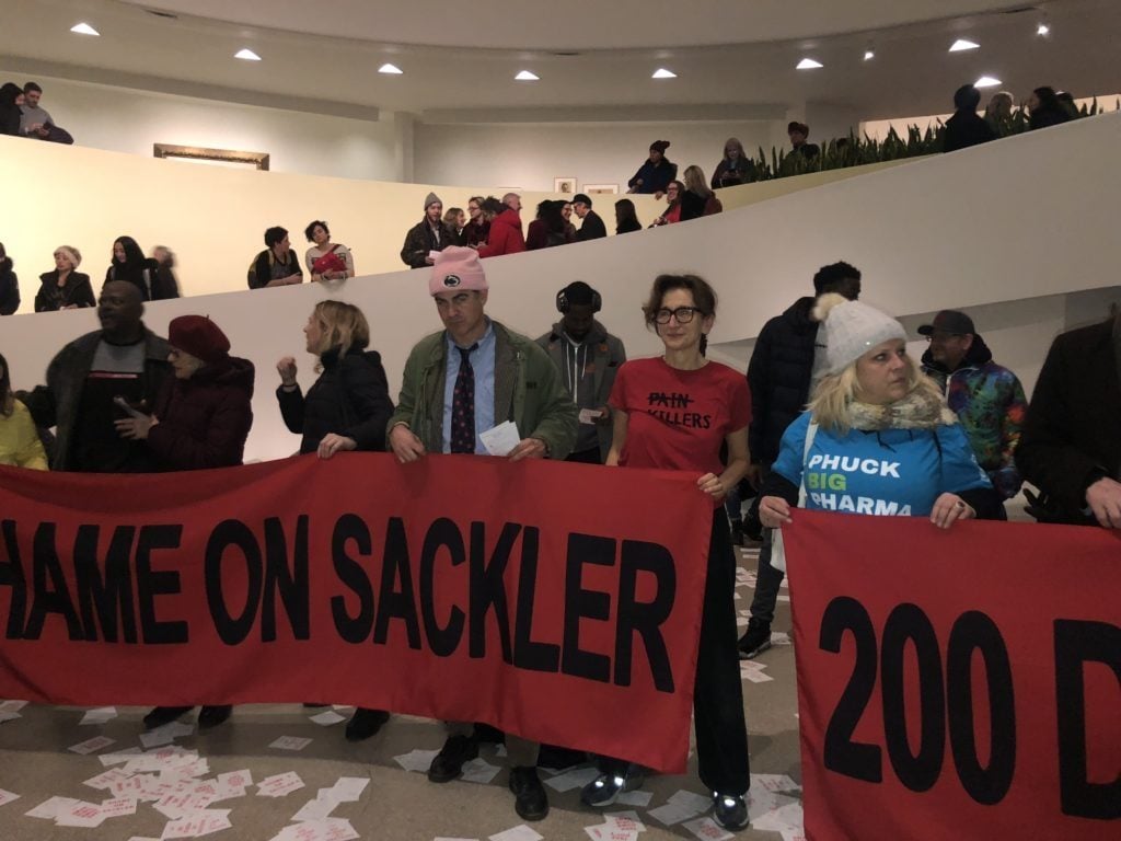 Protesters at the Guggenheim Museum have been pressuring the institution to cut its ties to the Sacklers. Photo: Caroline Goldstein.