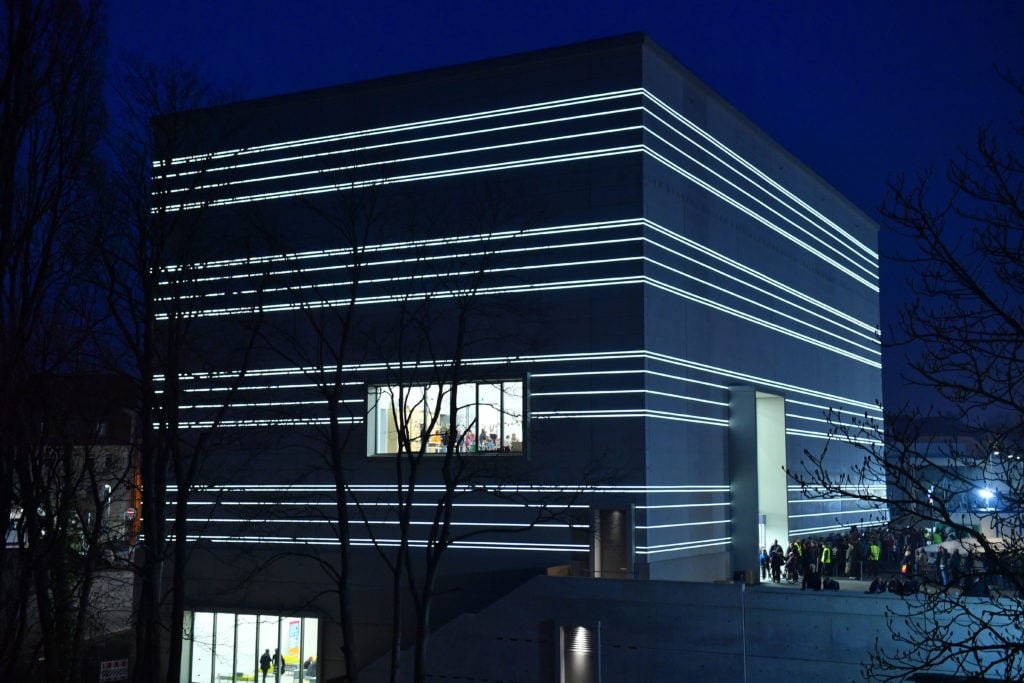 The Bauhaus Museum Weimar presents itself with white light bands on the façade on the day of its opening.