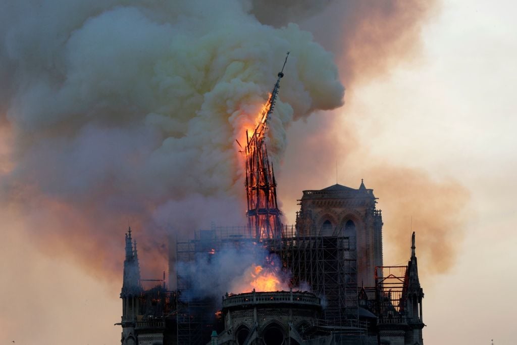 The spire of Notre Dame cathedral, designed by architect Eugène Viollet-le-Duc in the 19th century, collapsed when the cathedral caught fire in April 2019. Photo by Geoffroy Van der Hasselt/AFP/Getty Images.