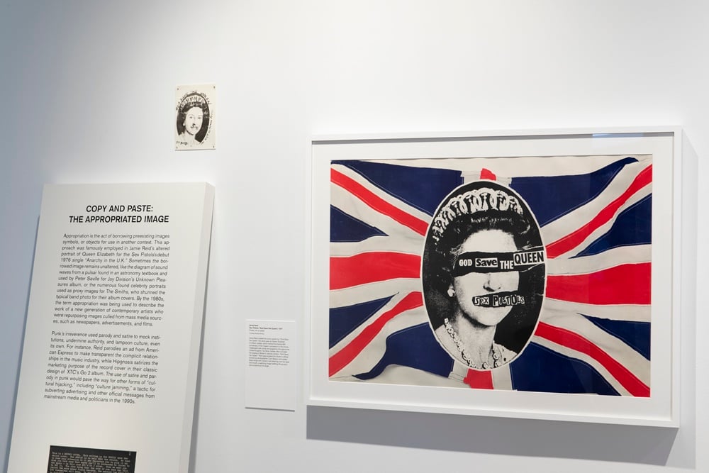 Installation view featuring Sex Pistols paraphernalia and "God Save the Queen" cover artwork. Image courtesy the Museum of Arts and Design.