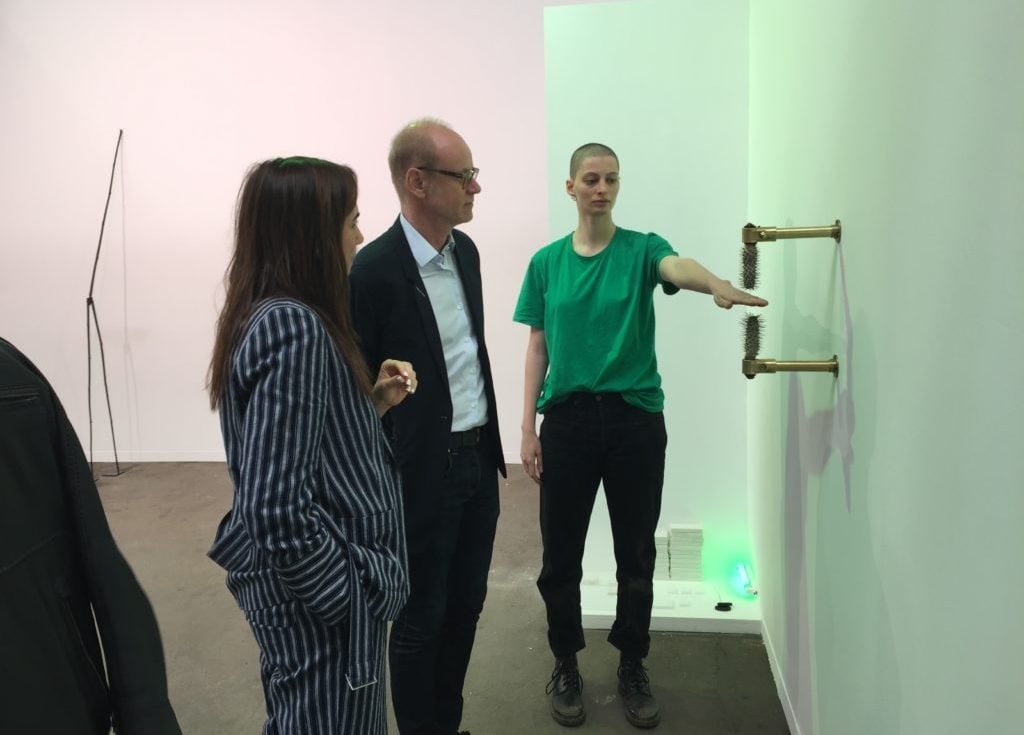 Frédéric de Goldschmidt and gallerist Catinca Tabacaru observe a performer activating Rachel Monosov's The Space in Between (2019). Photo by Naomi Rea.