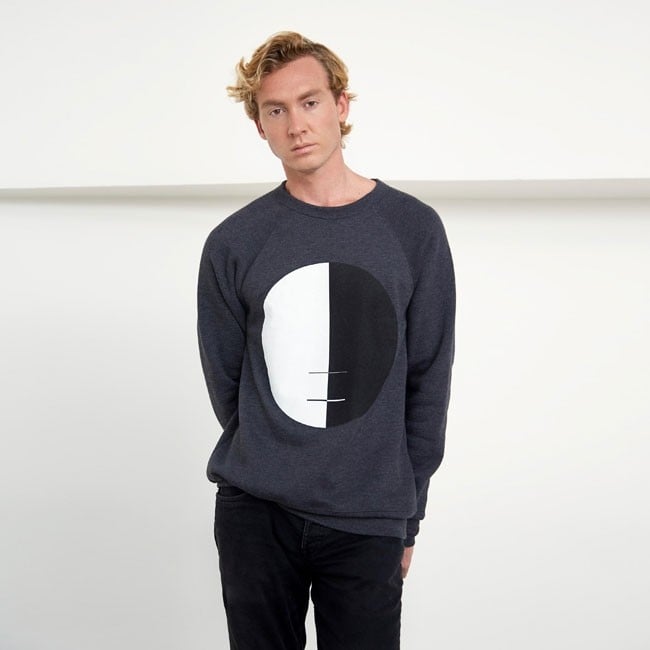 The "Buddha Pullover Sweatshirt, Grey with Black & White Circle," on male model. Image courtesy Guggenheim Store.