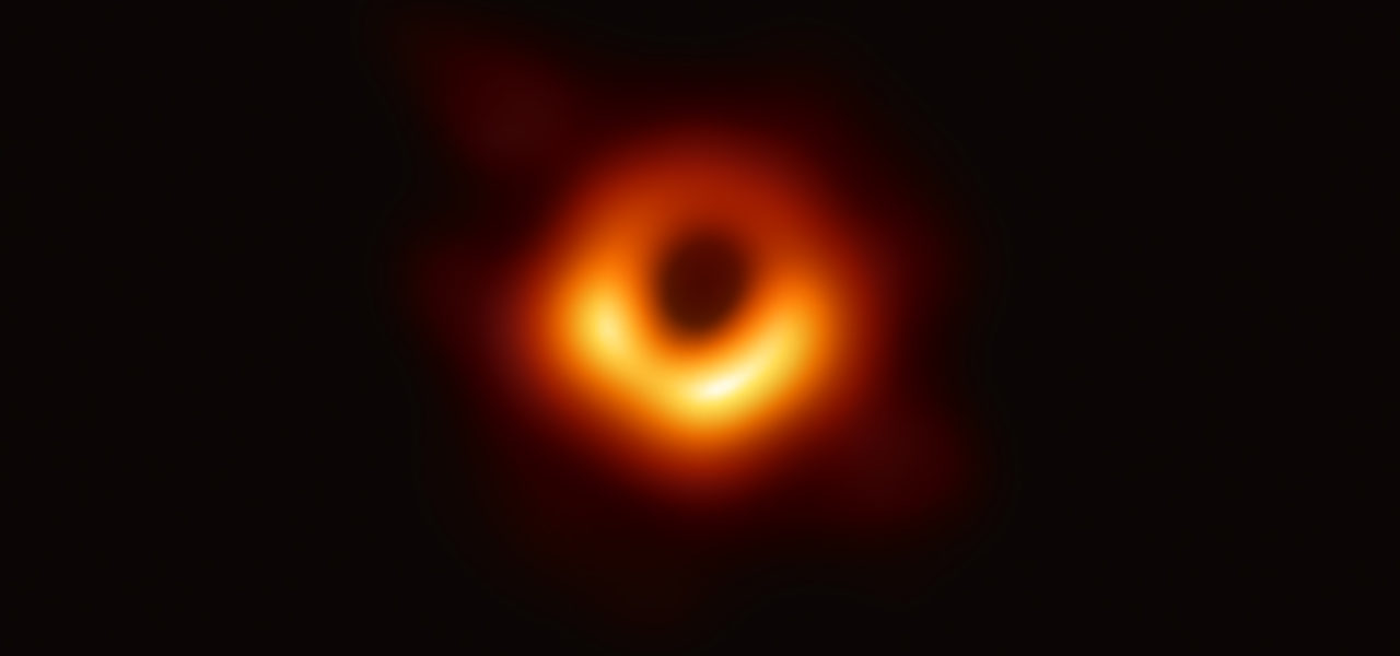 The Event Horizon Telescope— a planet-scale array of eight ground-based radio telescopes forged through international collaboration—was designed to capture images of a black hole. In coordinated press conferences across the globe, EHT researchers revealed that they succeeded, unveiling the first direct visual evidence of the supermassive black hole in the centre of Messier 87 and its shadow. The shadow of a black hole seen here is the closest we can come to an image of the black hole itself, a completely dark object from which light cannot escape. The image shows the light aroung black hole’s boundary, the event horizon. Image courtesy of the Event Horizon Telescope.