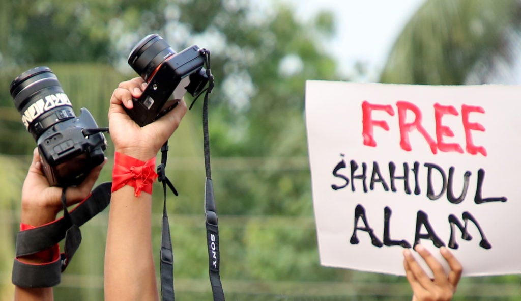 Photographers hold a rally held at Raju memorial monument at Dhaka University in Dhaka, Bangladesh on October 16, 2018, demanding immediate release of Shahidul Alam. Photo by Sony Ramany/NurPhoto via Getty Images.