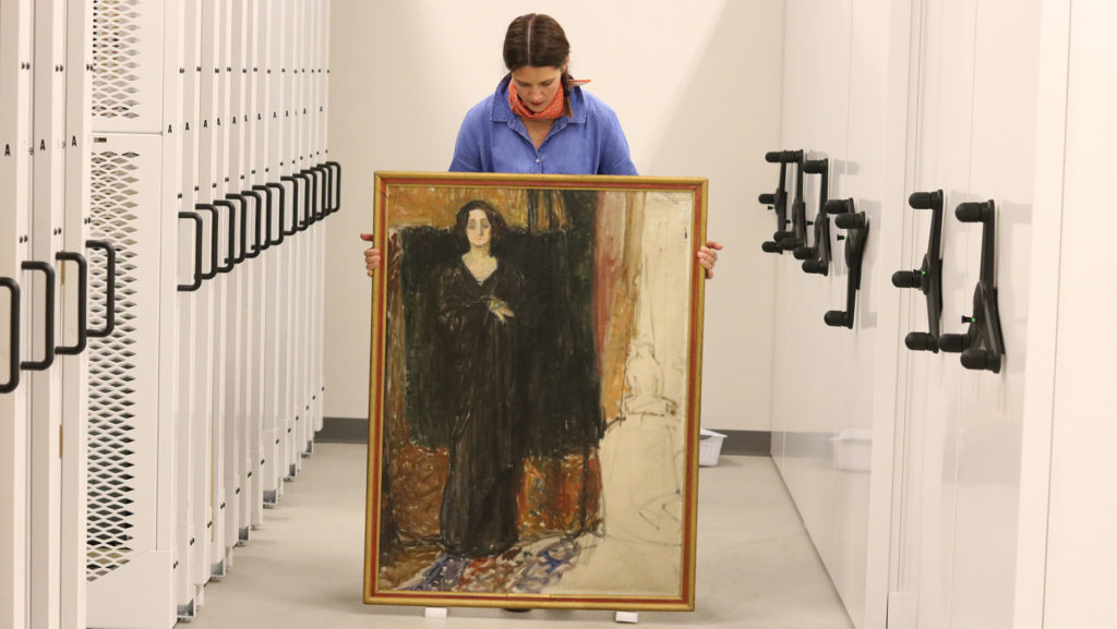 Flaten Art Museum Director Jane Becker Nelson ’04 with <em>Portrait of Eva Mudocci</em> attributed to Edvard Munch. Photo by Sarah Hansen for Museum of Art art St. Olaf's College. 