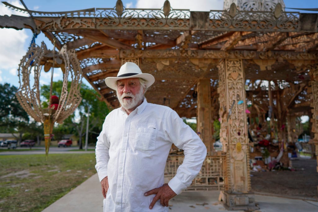 David Best with his sculpture Temple of Time (2019). The artwork, which honors the 17 victims of the 2018 Parkland, Florida, shooting, was set on fire May 19, 2019. Photo by Nicole Craine, courtesy of Bloomberg Philanthropies.