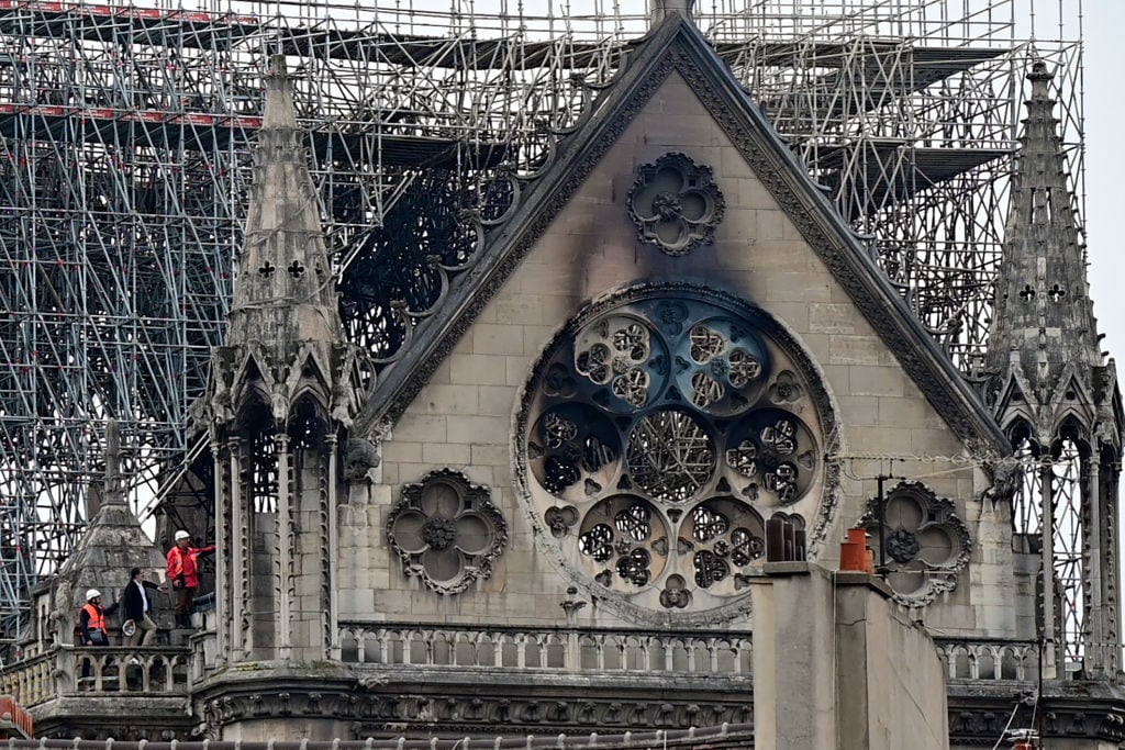 Inspectors on the roof of the Notre Dame cathedral in Paris. Photo: Lionel Bonaventure/AFP/Getty Images.