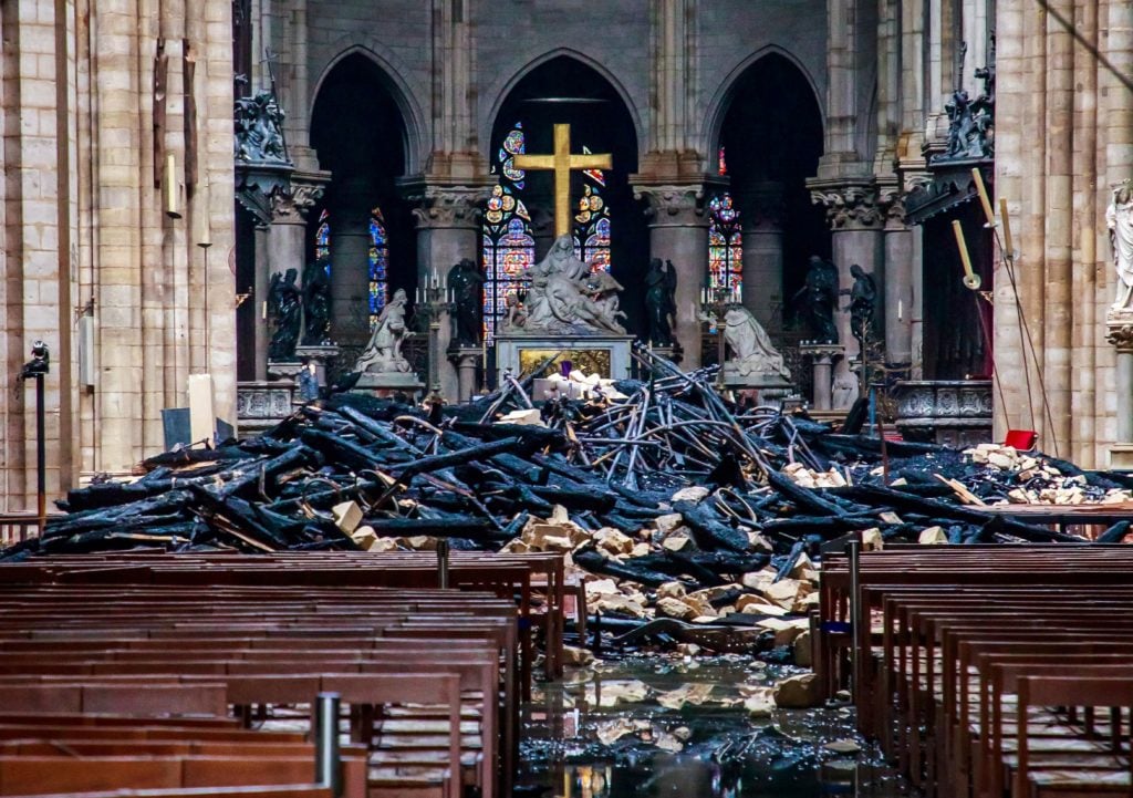 Debris inside the Notre-Dame-de Paris Cathedral in Paris after a fire that devastated the building. Photo: Christophe Petit Tesson/POOL/AFP/ Getty Images.