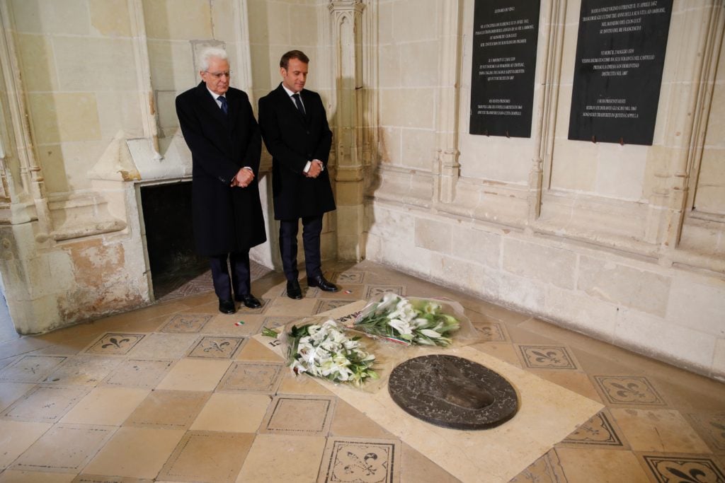 Italian President Sergio Mattarella (L) and French President Emmanuel Macron pay their respects at the tomb of Italian renaissance painter and scientist Leonardo da Vinci to commemorate the 500th anniversary of his death, at the Saint-Hubert Chapel of the Chateau d'Amboise during a visit in Amboise, on May 2, 2019. (Photo by PHILIPPE WOJAZER / POOL / AFP) (Photo credit should read PHILIPPE WOJAZER/AFP/Getty Images)
