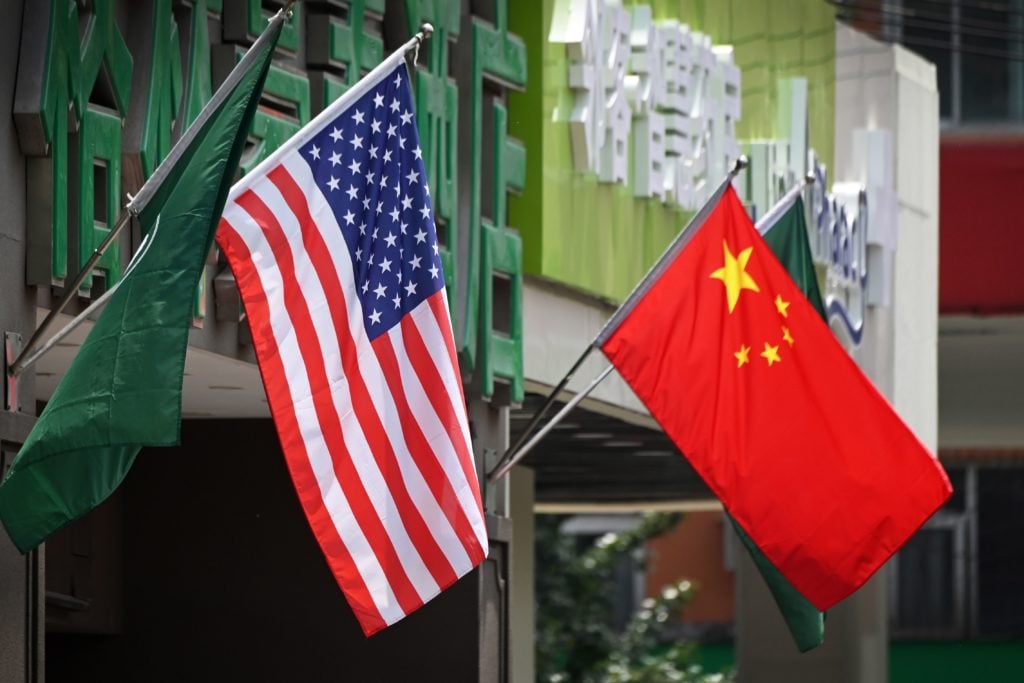 The US and Chinese flags are displayed outside a hotel in Beijing on May 14, 2019. Photo: Greg Baker/ AFP/Getty Images.