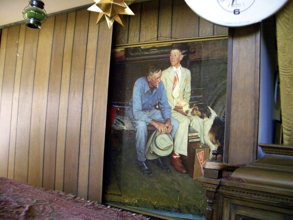 Norman Rockwell's Breaking Home Ties sits behind the fake wall where it was found by the owners' children. Courtesy of Joe Raedle/Getty Images.