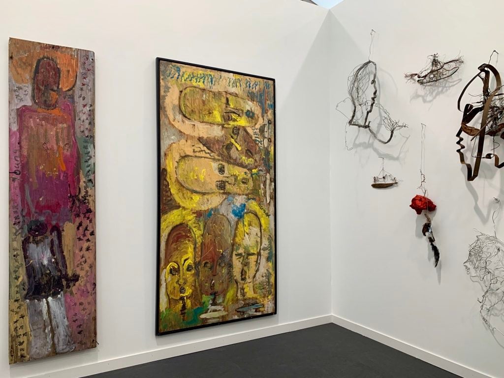 Work by Purvis Young and Lonnie Holley at James Fuentes Gallery at Frieze New York 2019. Photo by Sarah Cascone.