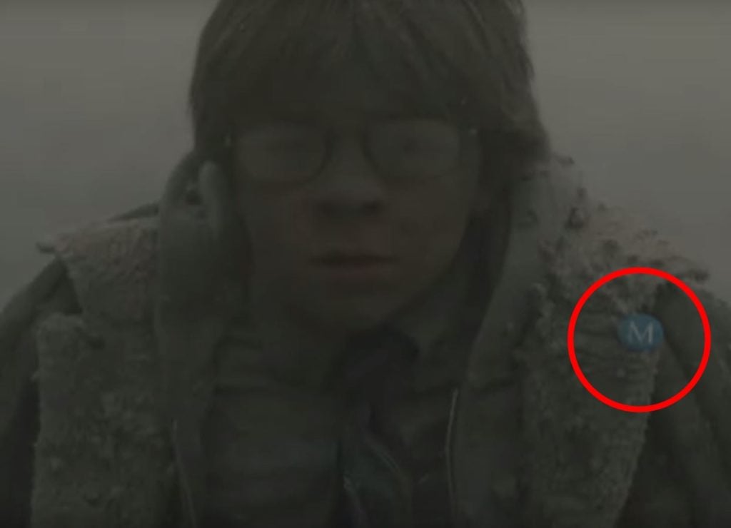 Screen capture from The Goldfinch trailer, with Metropolitan Museum of Art admission badge highlighted.