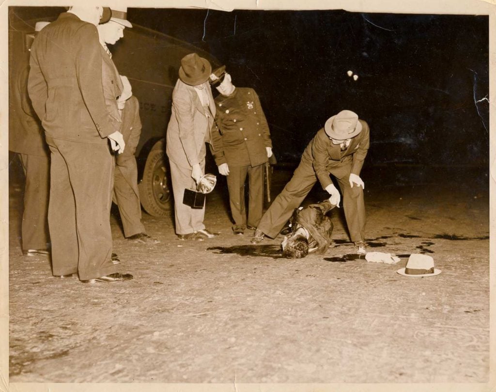 A newly discovered Weegee photograph of an unidentified murder victim at the scene of the crime. ©Weegee/International Center of Photography, New York.
