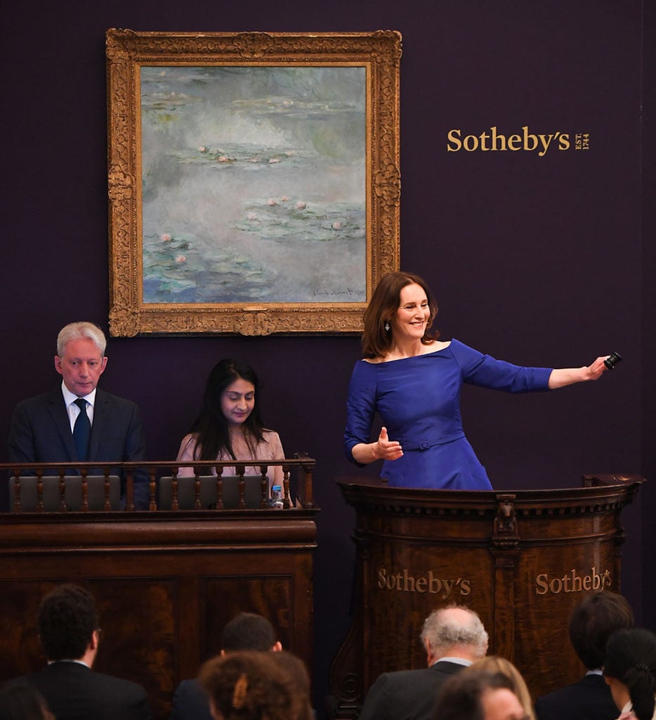 Sotheby’s European Chairman and auctioneer, Helena Newman fields bids at Sotheby’s Impressionist &Modern Art sale in London, 2019. Photo by Chris J Ratcliffe/Getty Images for Sotheby's.