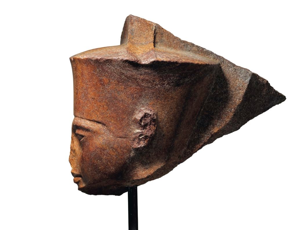 The Egyptian brown quartzite head of the God Amun with features of the Pharaoh Tutankhamen. (around 1333–1323 B.C.) Photo courtesy Christie's.