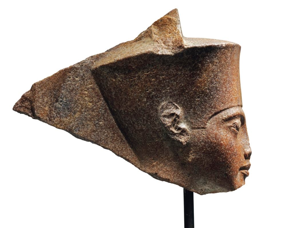 The Egyptian brown quartzite head of the God Amen with features of the Pharaoh Tutankhamen. (around 1333-1323 B.C.) Photo courtesy Christie's.