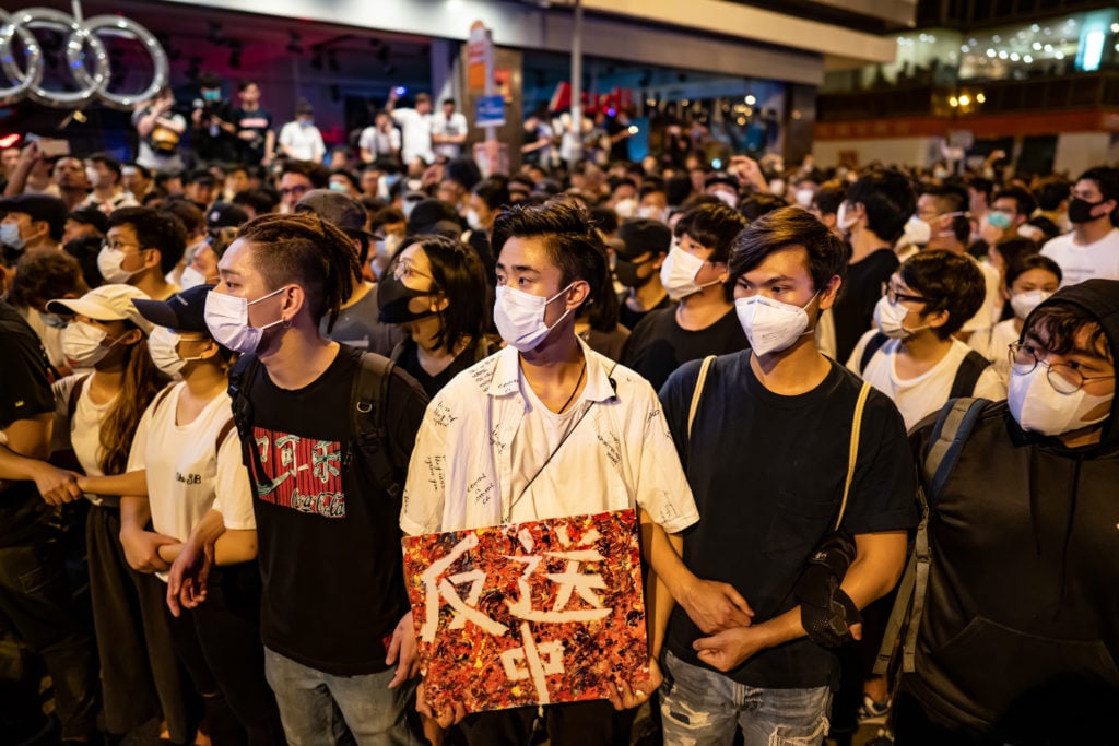 Protesters occupy a street after a rally against the extradition law proposal at the Central Government Complex on June 10, 2019 in Hong Kong China. Over a million protesters marched in Hong Kong on Sunday against a controversial extradition bill that would allow suspected criminals to be sent to mainland China for trial as tensions escalated in recent weeks. Photo by Anthony Kwan/Getty Images.