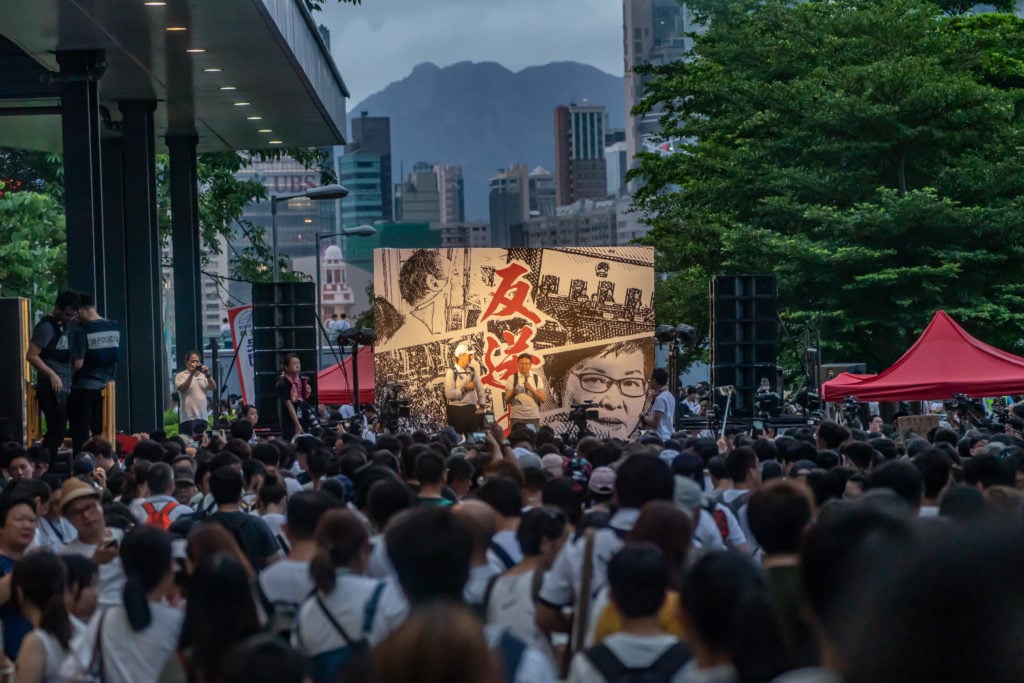 Protesters march on a street during a rally against the extradition law proposal on June 9, 2019 in Hong Kong China. Photo by Anthony Kwan/Getty Images.