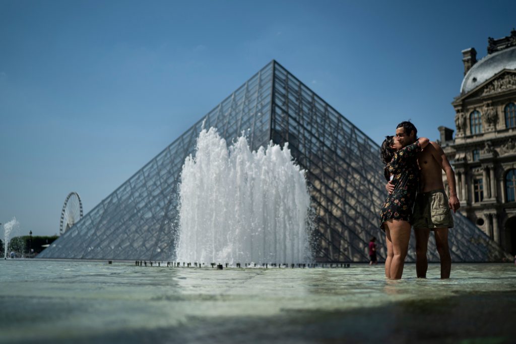 It is HOT in Europe. Cool off in a museum. And maybe see a show if ya feel like it. Photo: KENZO TRIBOUILLARD/AFP/Getty Images.