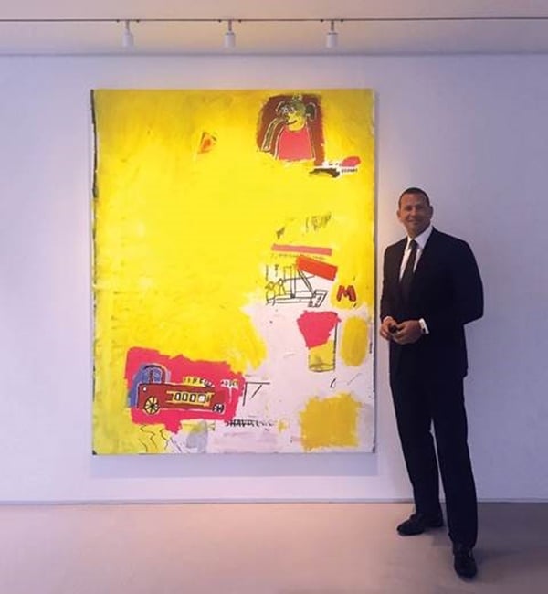Alex Rodriguez with Jean-Michel Basquiat's Pink Elephant with Fire Engine (1984). Image courtesy of Phillips.