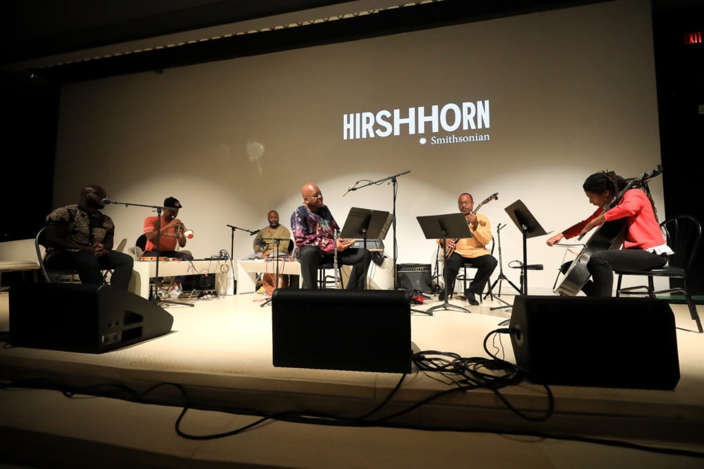 Saïs Kamalidiin (third from right), Leonard Brown (second from right), and Tomeka Reid (far right) with Theaster Gates (third from left) and the Black Monks at <i>Discussions of the Sonic Imagination, Part I</i>, June 16, 2019, at the Hirshhorn Museum and Sculpture Garden. Photo by Tony Powell.