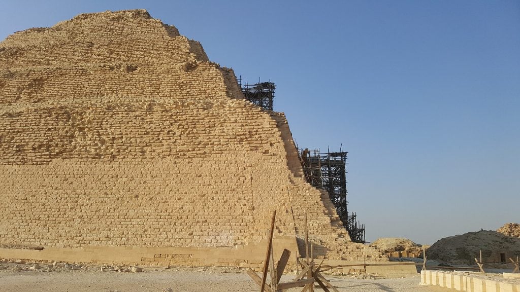 A close up shot of the Djoser pyramid, a stone stepped pyramid, after a controversial renovation that smoothed its walls. 