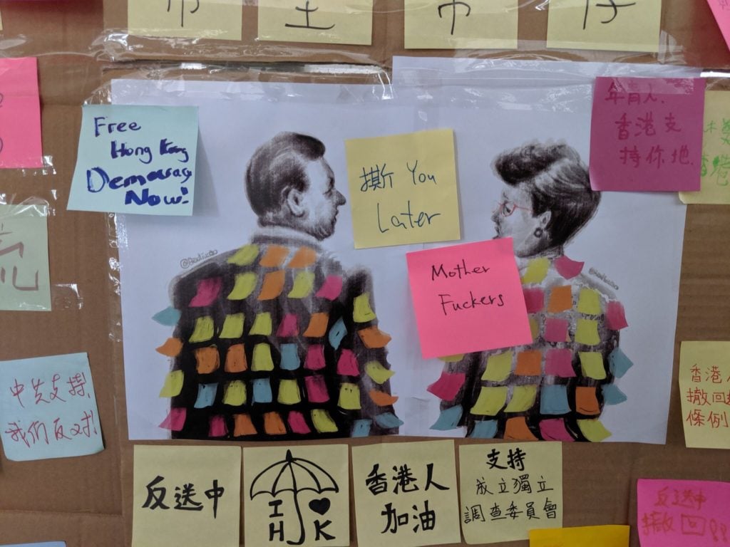 An illustration of Chinese president Xi Jinping and Hong Kong chief executive Carrie Lam covered with Post-Its by Badiucao ends up on one of the "Lennon walls" in Hong Kong. Courtesy of Badiucao.