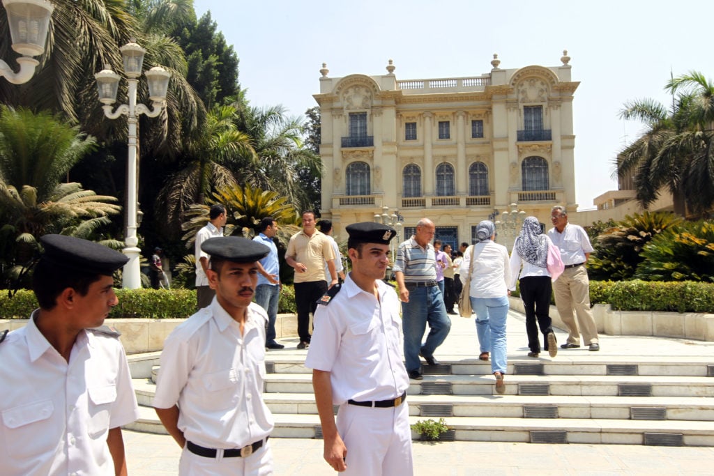 Egyptian police walk inside the grounds of the Mohammed Mahmoud Khalil Museum in Cairo on August 22, 2010, a day after a Van Gogh painting 'Poppy Flowers' valued at more than 50 million dollars was cut out of its frame and stolen. Courtesy of KHALED DESOUKI/AFP/Getty Images. 