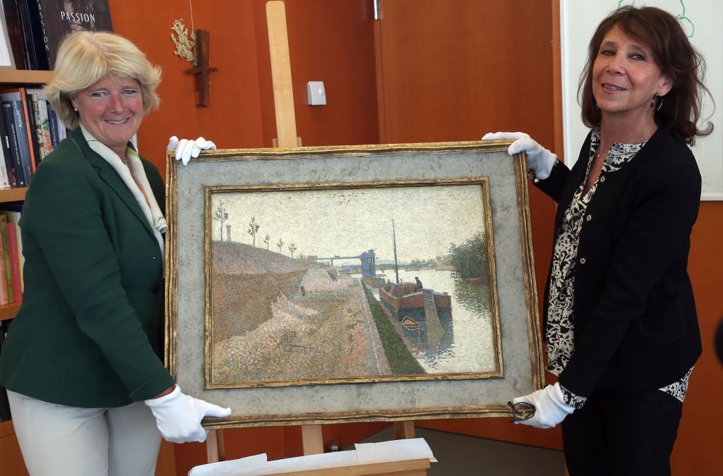 Germany culture minister Monika Gruetters hands over Quai de Clichy by Paul Signac.