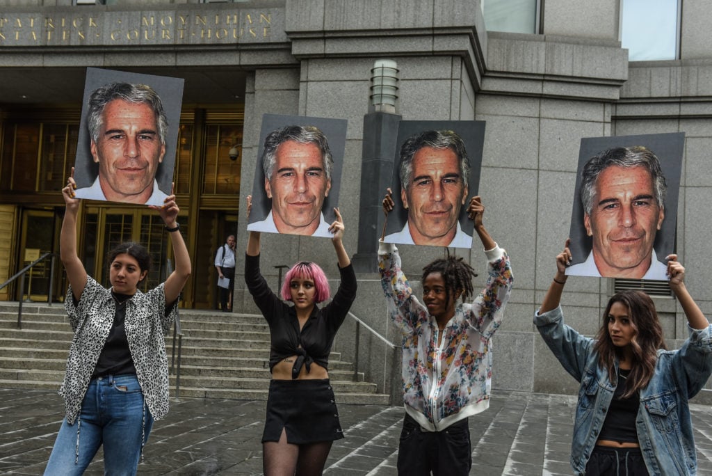 Protesters outside the courthouse where Jeffrey Epstein was charged with sex trafficking and conspiracy to traffic minors in New York City. (Photo by Stephanie Keith/Getty Images)