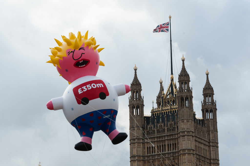 Boris Blimp balloon depicting Tory leadership hopeful Boris Johnson flies next to the Houses of Parliament ahead of anti-Brexit Yes to Europe, no to Boris demonstration on 20 July, 2019 in London, England. Photo by WIktor Szymanowicz/NurPhoto via Getty Images.