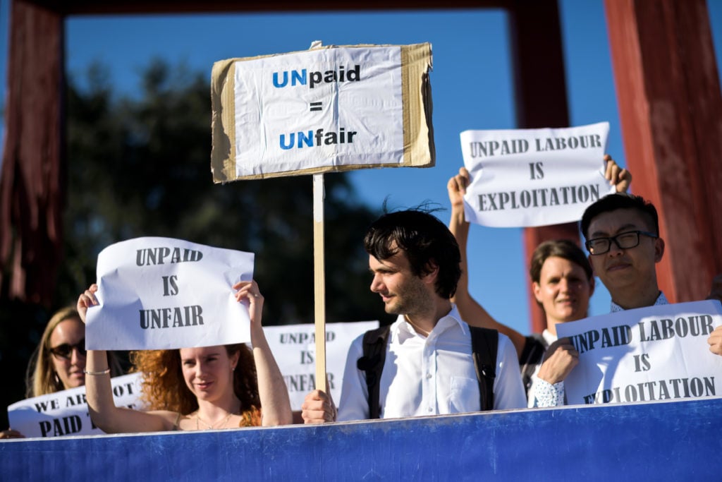 Unpaid interns protesting at the United Nations in Geneva. Photo by Fabrice Coffrini/AFP/Getty Images.