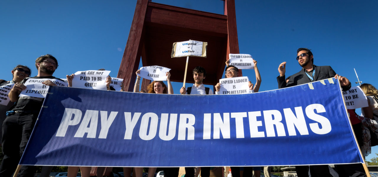 Unpaid interns protesting at the United Nations in Geneva. Photo by Fabrice Coffrini/AFP/Getty Images.