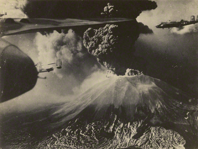 American B-25 Mitchell Bombers fly past Mount Vesuvius during its eruption in March 1944. Photo courtesy of the Archive of Raymond D. Yusi, Army Corps of Engineers.