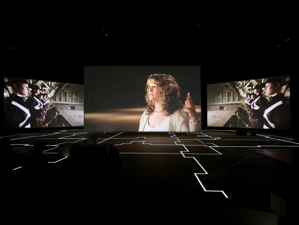 At center: Image of Abby Clements, a survivor of the Sandy Hook shooting, in Hito Steyerl, Drill (2019) at the Park Avenue Armory. Image: Ben Davis.