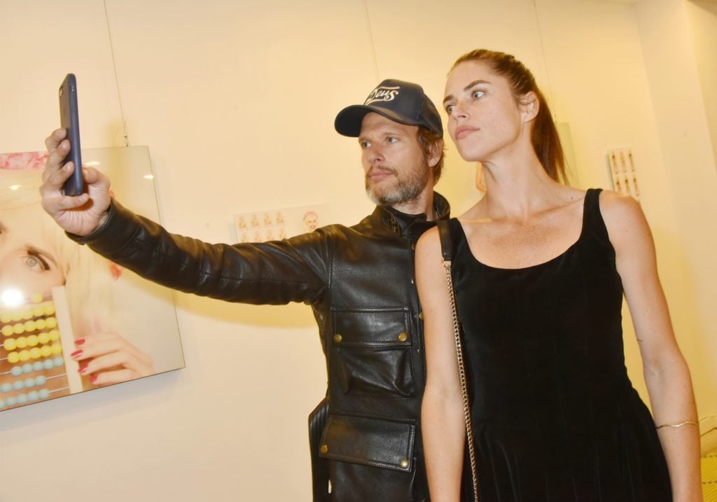 Artist Zoe Duchesne and a guest pose for a selfie during the "'Poupees' de Zoe Duchene" preview at Galerie Marguerite Milin on September 13, 2018 in Paris, France. Photo by Foc Kan/WireImage.