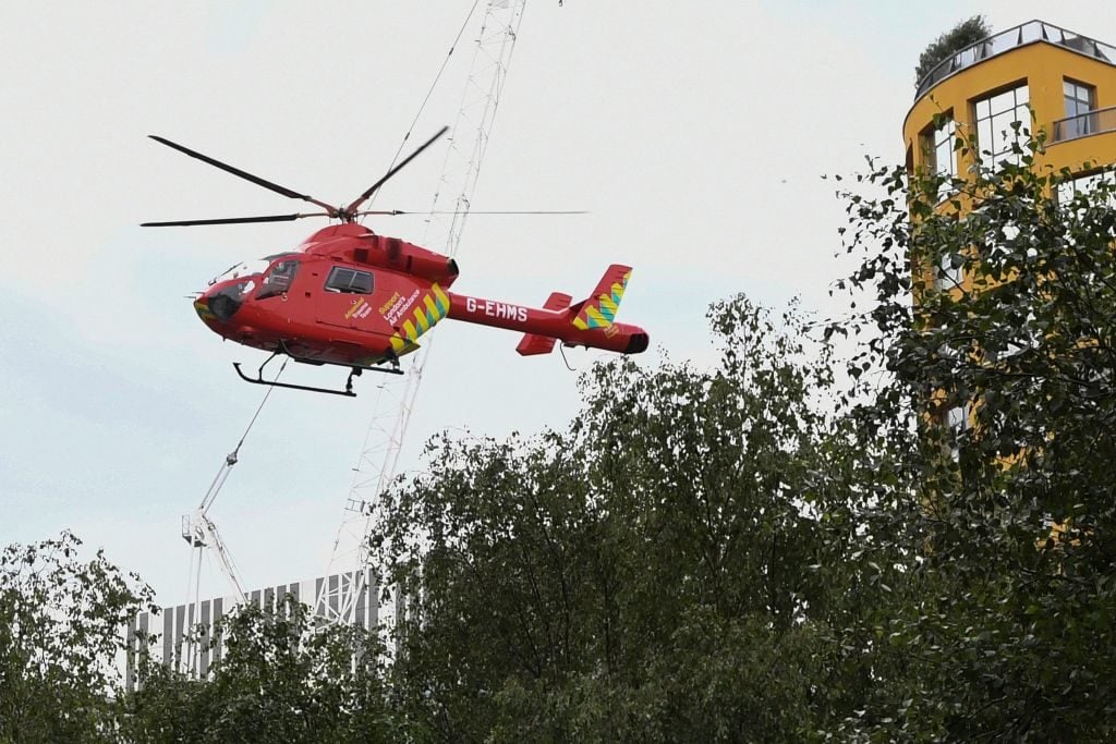 A London Air Ambulance helicopter takes off from outside the Tate Modern gallery in London on August 4, 2019 after it was put on lock down and evacuated after an incident involving a child falling from height and being airlifted to hospital. Photo by Daniel Sorabji/AFP/Getty Images.