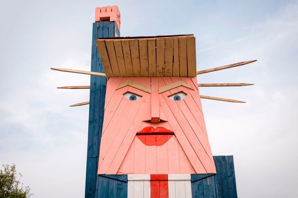 A wooden structure made to resemble US President Donald Trump in the village of Sela pri Kamniku, Slovenia. Photo credit should read JURE MAKOVEC/AFP/Getty Images.