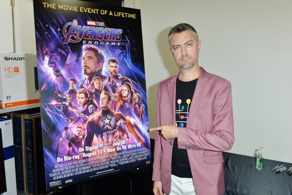 Actor Sean Gunn with a poster for Marvel's <i>Avengers: Endgame<i>. (Photo by Jerod Harris/Getty Images)